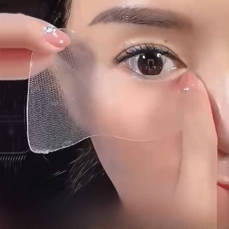 Close-up of a person applying a clear patch over their eye.