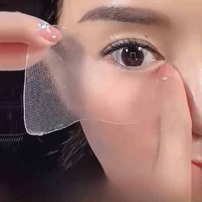 Close-up of a person applying a clear patch over their eye.