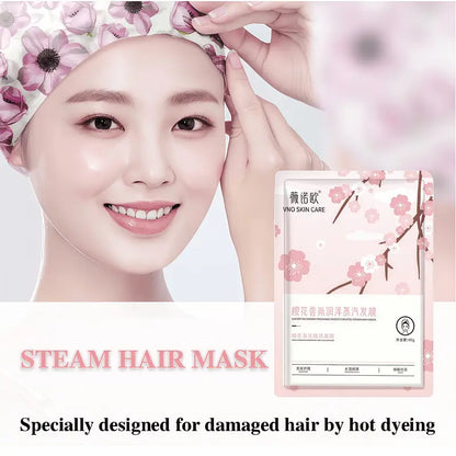 Steam hair mask packaging with floral design and text on a light pink background